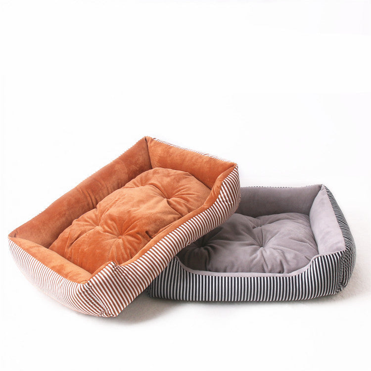 Rectangular pet bed with plush tufted cushion and striped bolster sides, shown in orange and grey