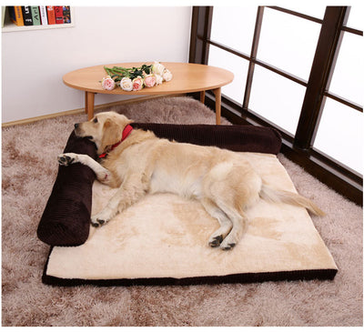 Golden retriever resting on an L-shaped bolster dog bed with cream plush mat and brown cushioned sides